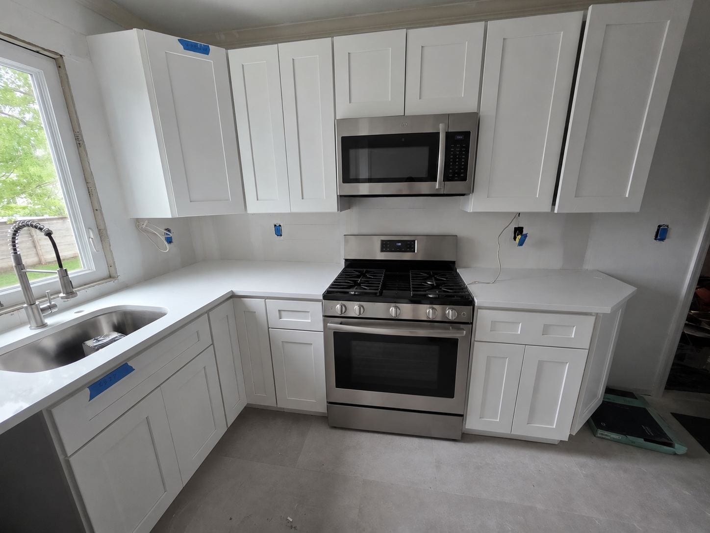White shaker, stainless package — A&J Cabinet Studio install