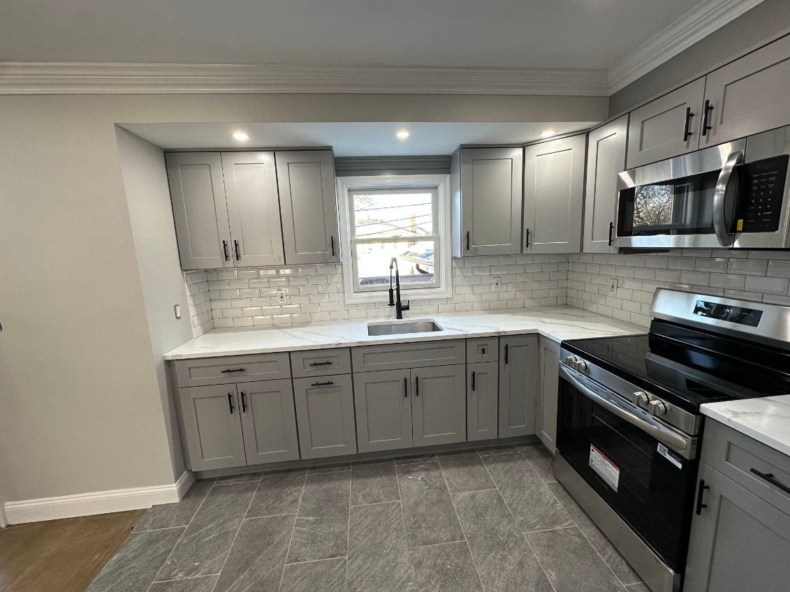 Grey shaker with white subway tile — A&J Cabinet Studio install